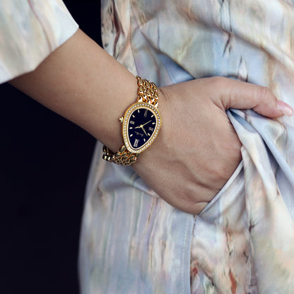 Women Wearing Gold Watch With Black Dial