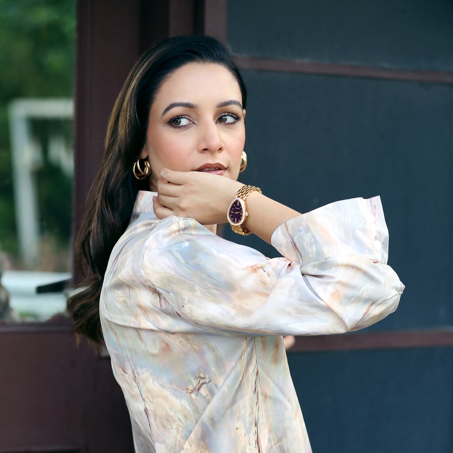 Women Wearing Gold Watch With Black Dial