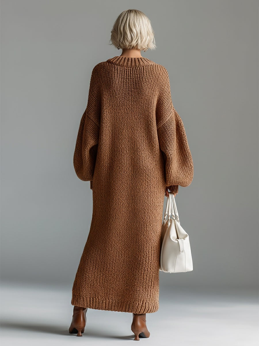 Woman wearing an oversized chunky knit maxi jumper dress with balloon sleeves and ribbed crew neck - view 10