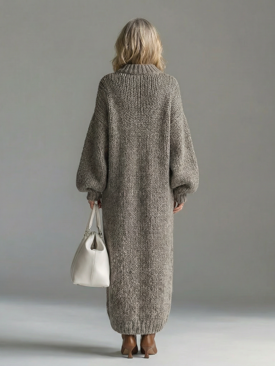 Woman wearing an oversized chunky knit maxi jumper dress with balloon sleeves and ribbed crew neck - view 6
