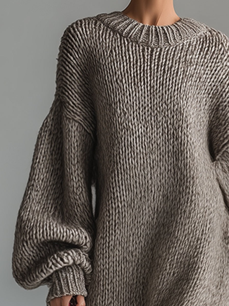 Woman wearing an oversized chunky knit maxi jumper dress with balloon sleeves and ribbed crew neck - view 7