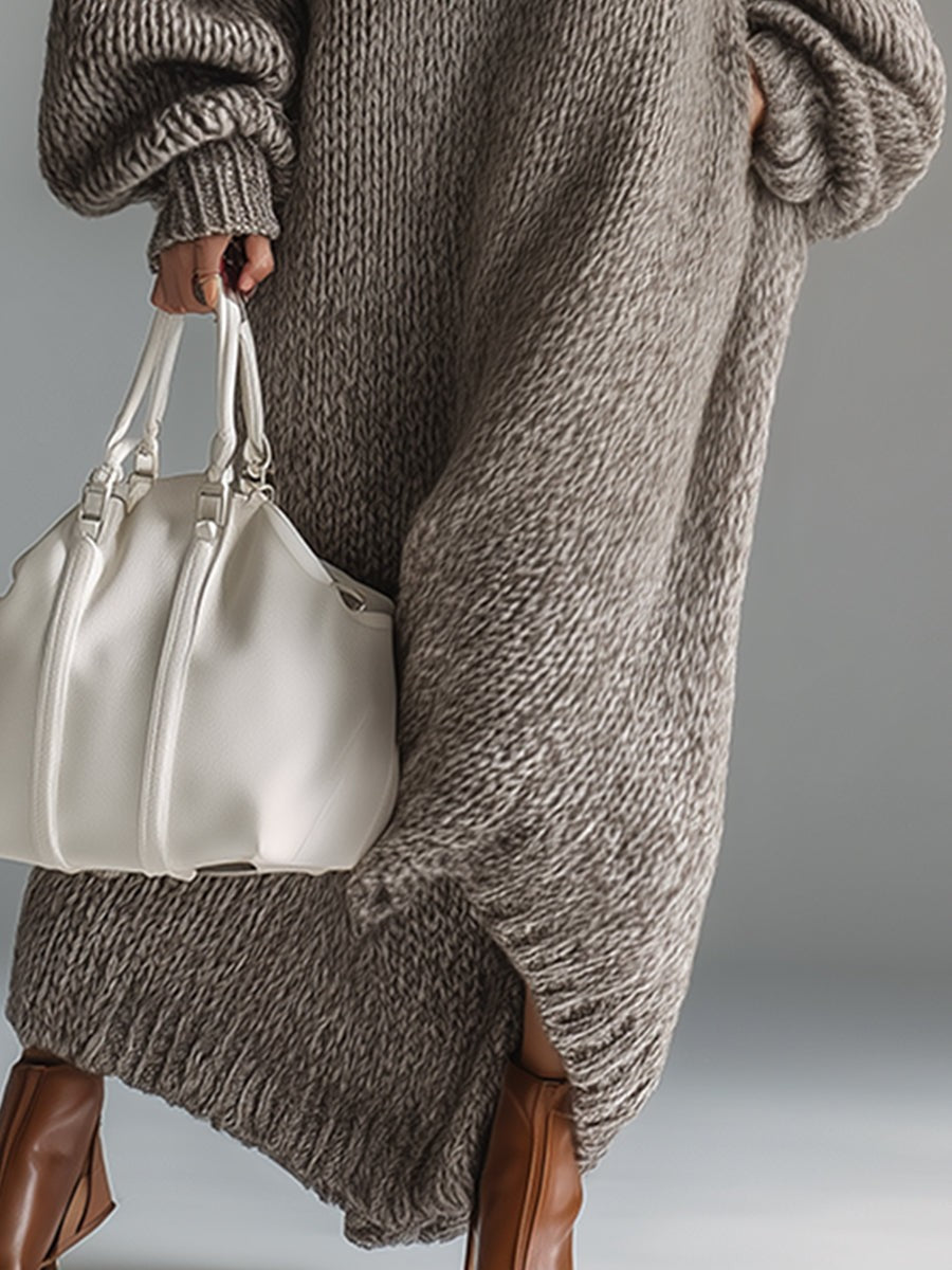 Woman wearing an oversized chunky knit maxi jumper dress with balloon sleeves and ribbed crew neck - view 8