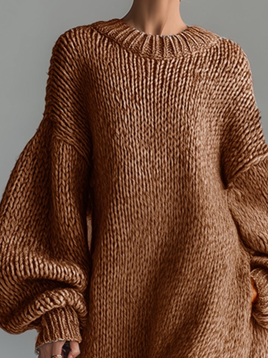 Woman wearing an oversized chunky knit maxi jumper dress with balloon sleeves and ribbed crew neck - view 9