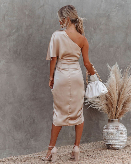 Woman wearing a one shoulder satin cocktail dress with ruched waist and wrap-front split midi skirt - view 2