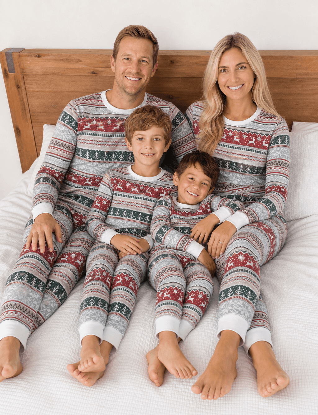 Family wearing matching Fair Isle Christmas pyjamas with reindeer and snowflake print - view 2
