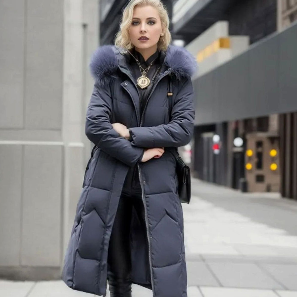 Woman wearing a long cream quilted winter coat with faux fur trimmed hood - view 15