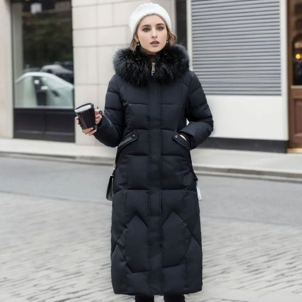 Woman wearing a long cream quilted winter coat with faux fur trimmed hood - view 6