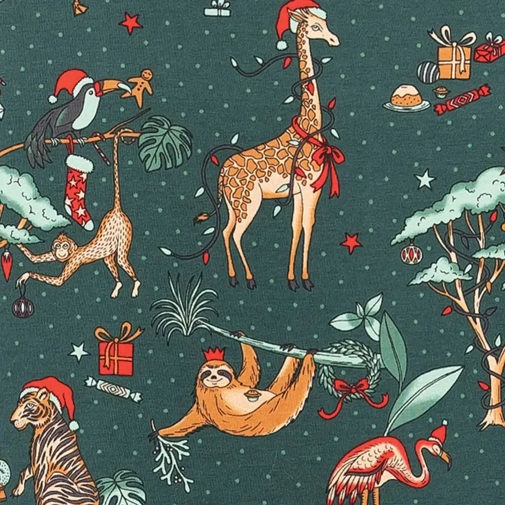 Family wearing matching forest green Christmas pyjamas with safari animal print - view 13