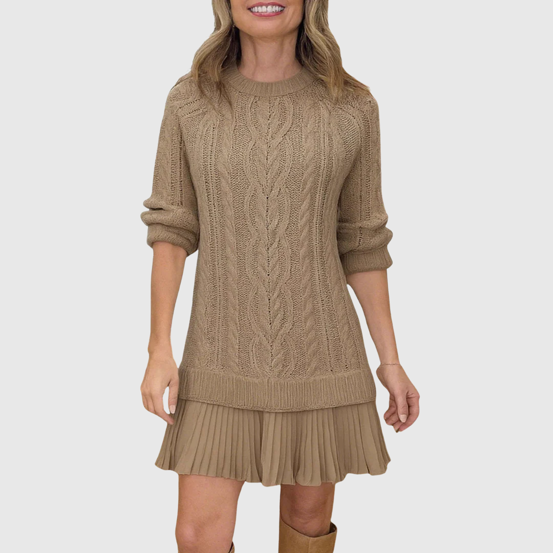 Woman wearing a cable knit jumper dress with a crew neck, long sleeves and pleated mini hem - view 3