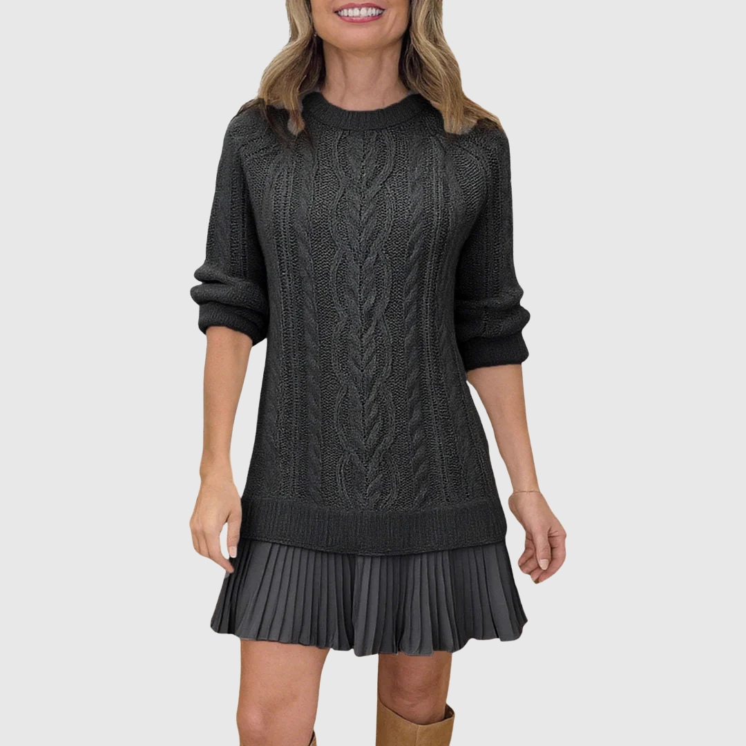 Woman wearing a cable knit jumper dress with a crew neck, long sleeves and pleated mini hem - view 5