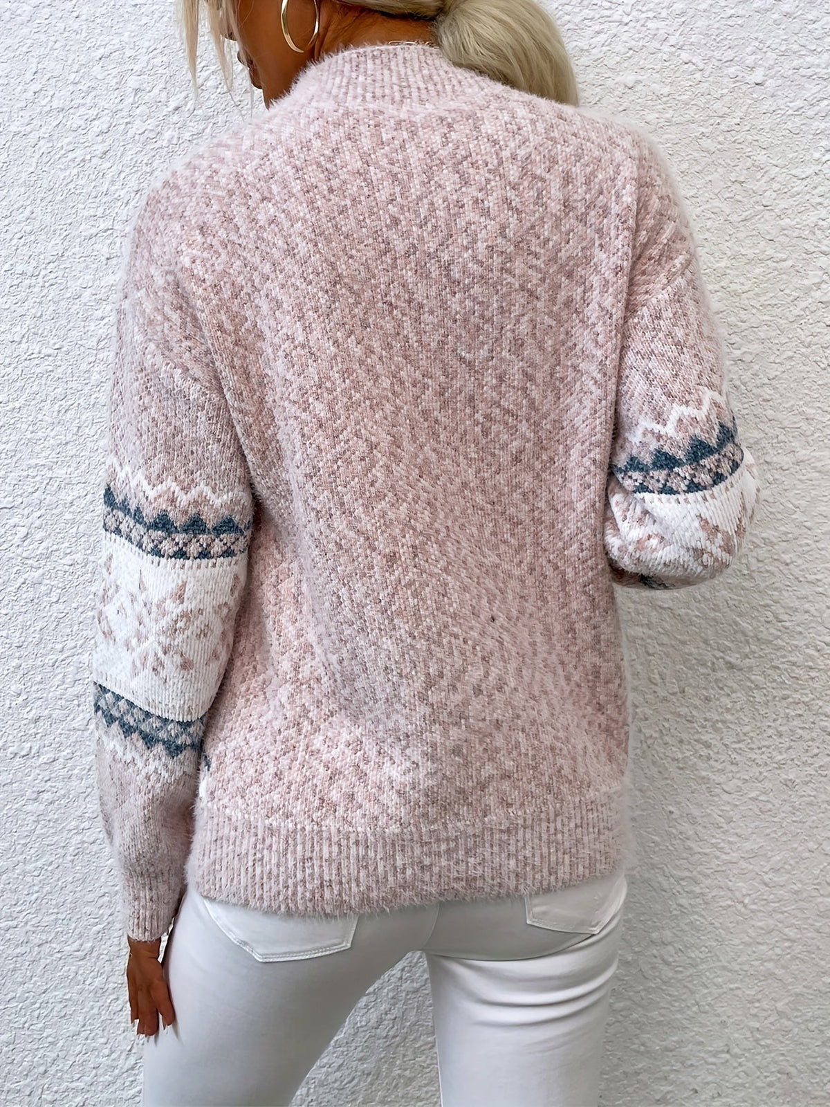 Woman wearing a blue speckled Fair Isle snowflake mock neck jumper with white jeans - view 10