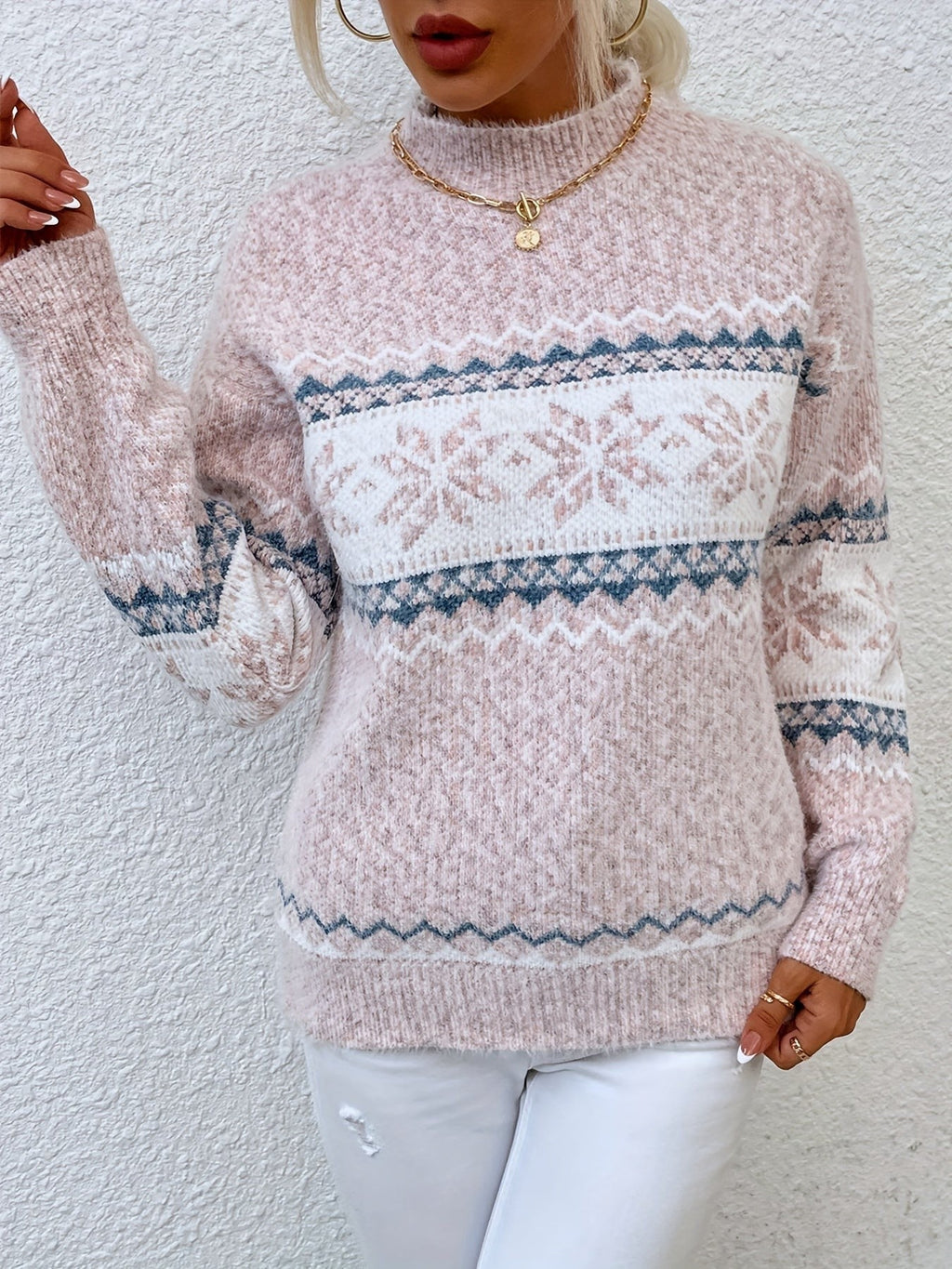 Woman wearing a blue speckled Fair Isle snowflake mock neck jumper with white jeans - view 12
