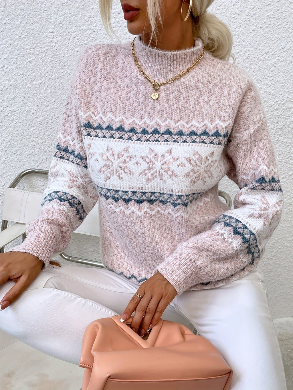Woman wearing a blue speckled Fair Isle snowflake mock neck jumper with white jeans - view 15