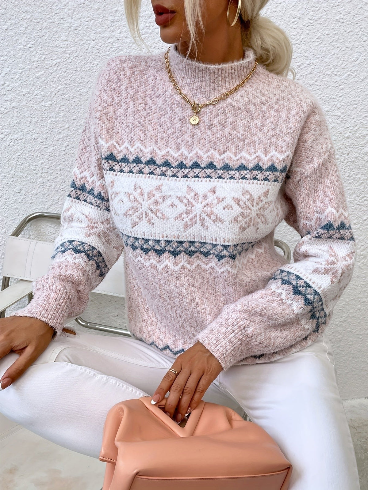 Woman wearing a blue speckled Fair Isle snowflake mock neck jumper with white jeans - view 15