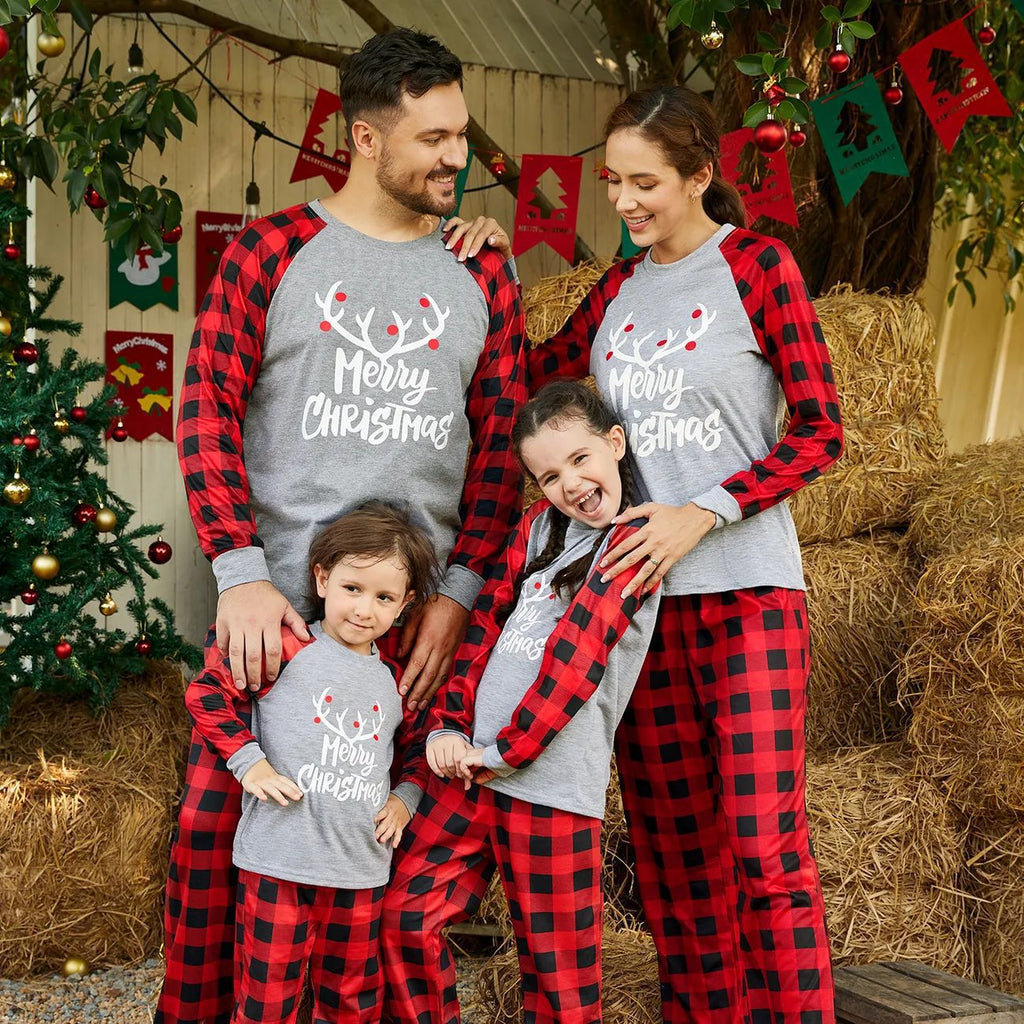 Matching family Christmas pajamas with gray reindeer antler Merry Christmas top, red buffalo plaid raglan sleeves and plaid pants