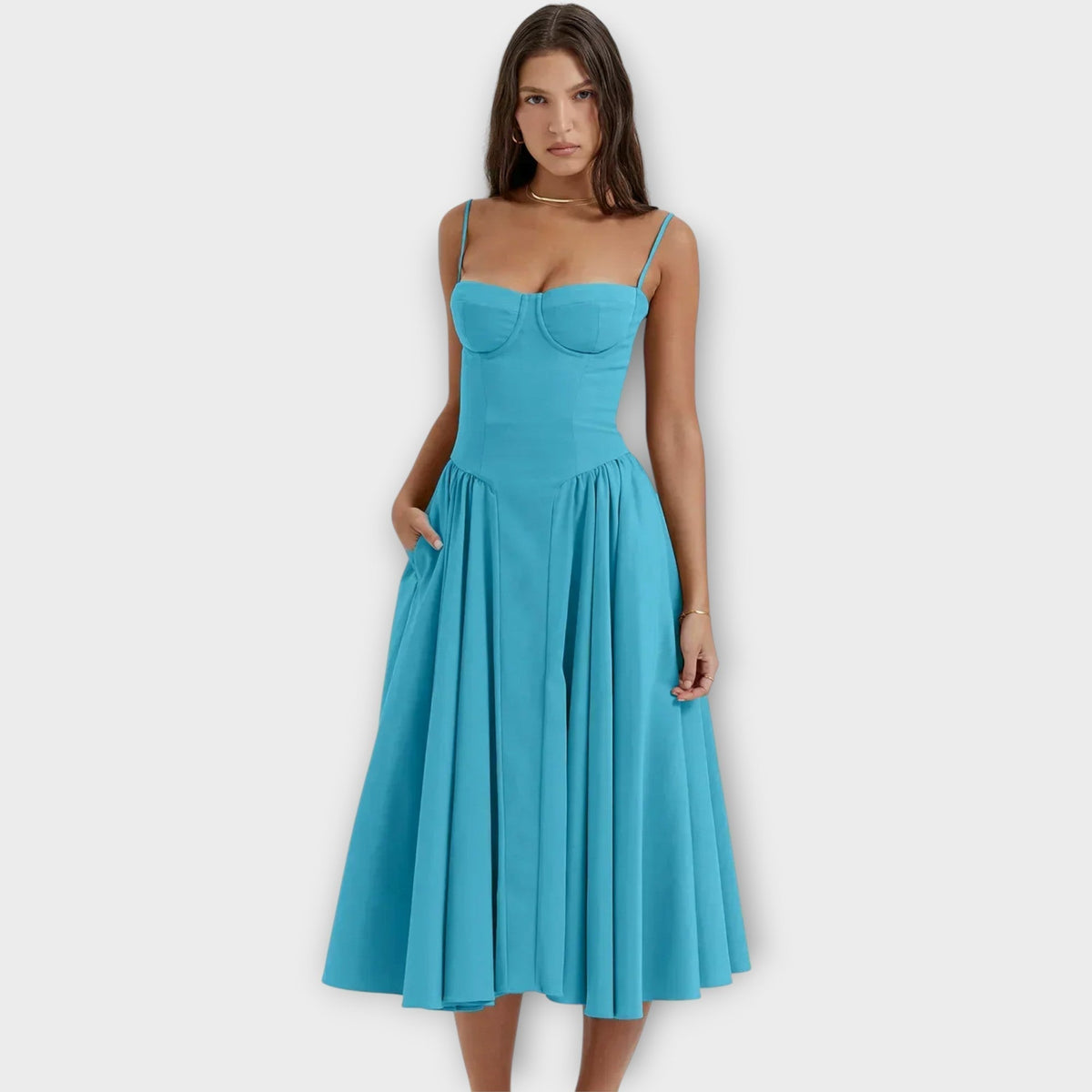 Woman wearing a sleeveless sweetheart corset midi dress with spaghetti straps and a full gathered skirt - view 11