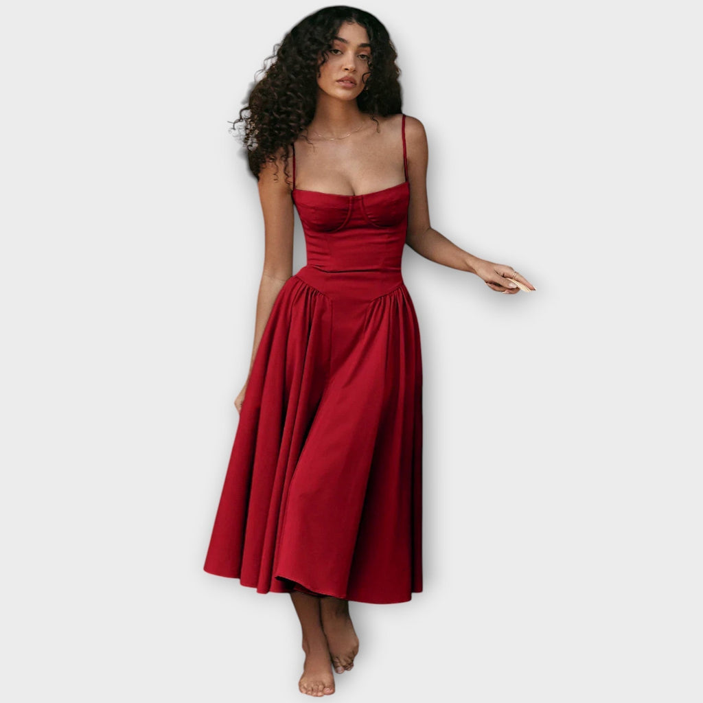Woman wearing a sleeveless sweetheart corset midi dress with spaghetti straps and a full gathered skirt - view 13
