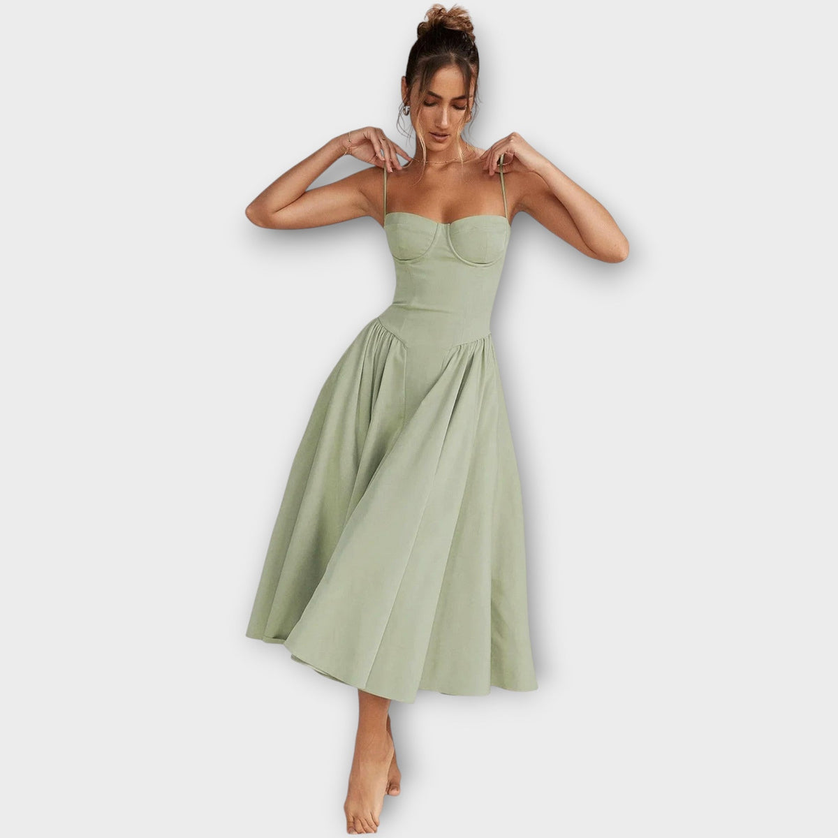 Woman wearing a sleeveless sweetheart corset midi dress with spaghetti straps and a full gathered skirt - view 2