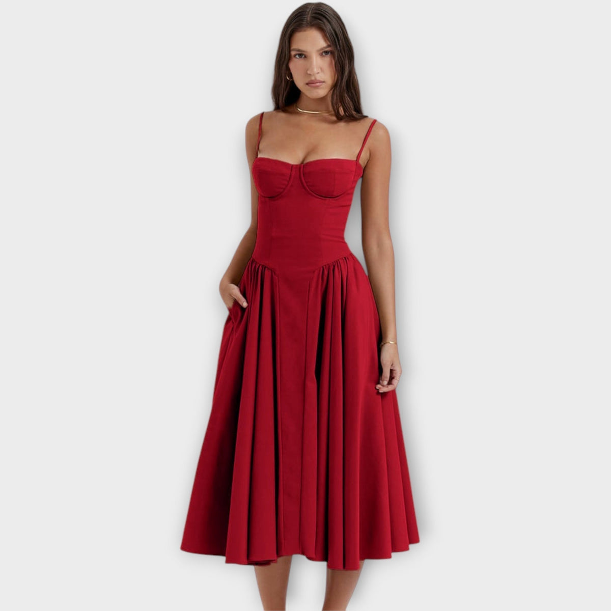 Woman wearing a sleeveless sweetheart corset midi dress with spaghetti straps and a full gathered skirt - view 4