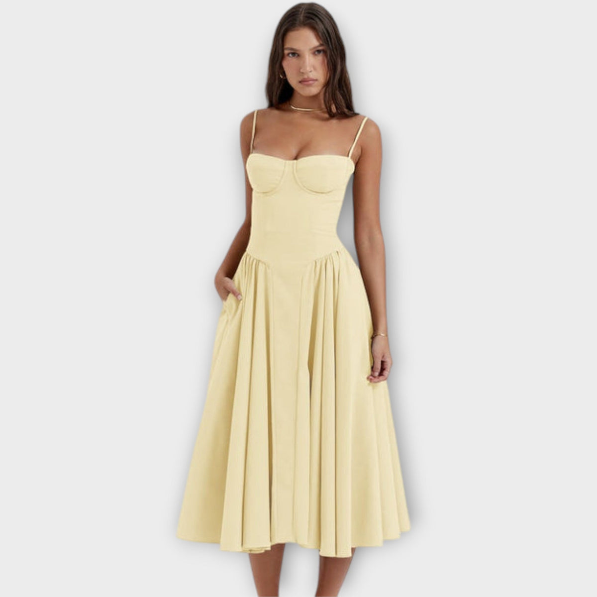 Woman wearing a sleeveless sweetheart corset midi dress with spaghetti straps and a full gathered skirt - view 6