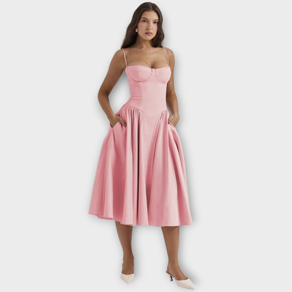 Woman wearing a sleeveless sweetheart corset midi dress with spaghetti straps and a full gathered skirt - view 7