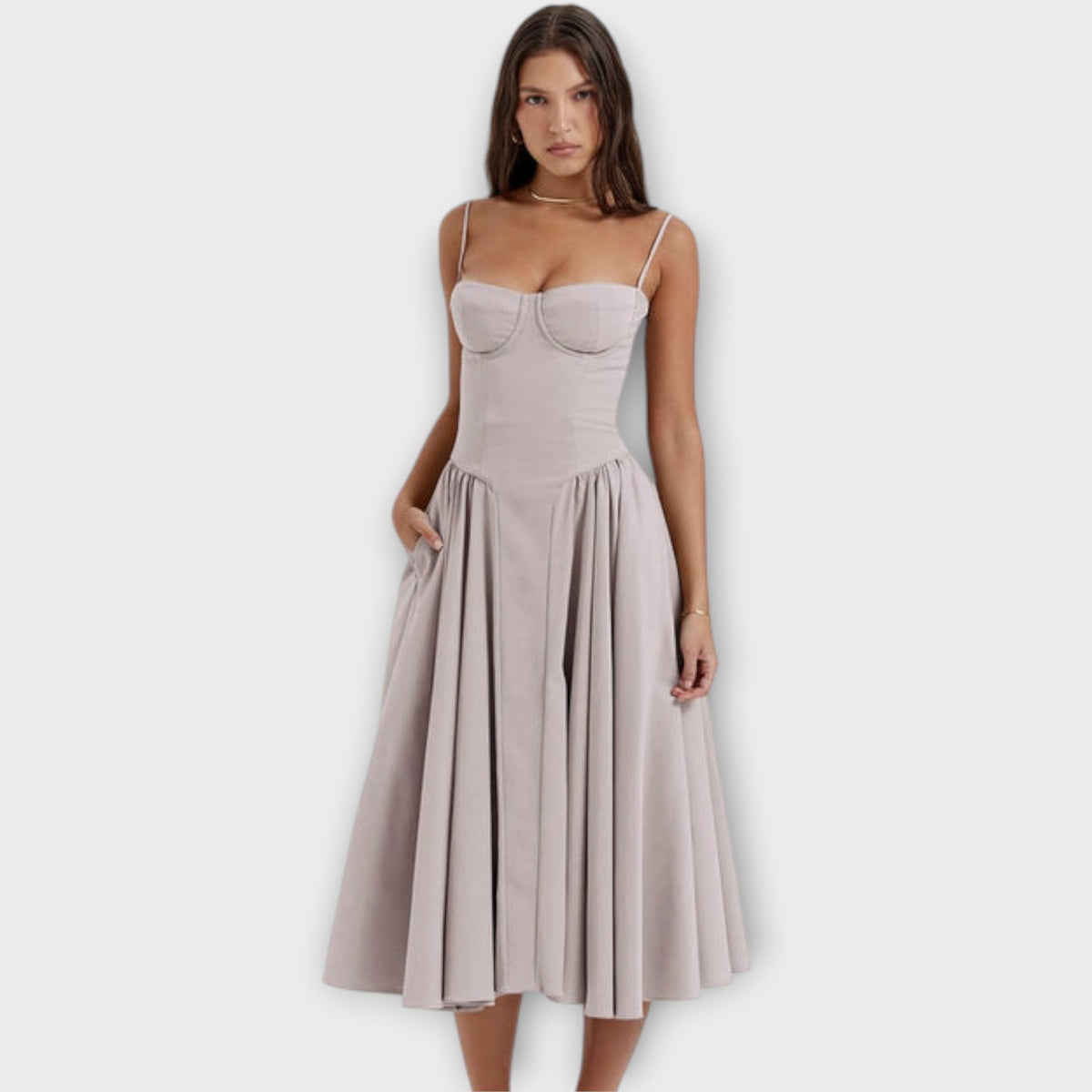 Woman wearing a sleeveless sweetheart corset midi dress with spaghetti straps and a full gathered skirt - view 8