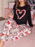 Women's Christmas pajama set with black long sleeve candy cane heart gingerbread top and printed pants