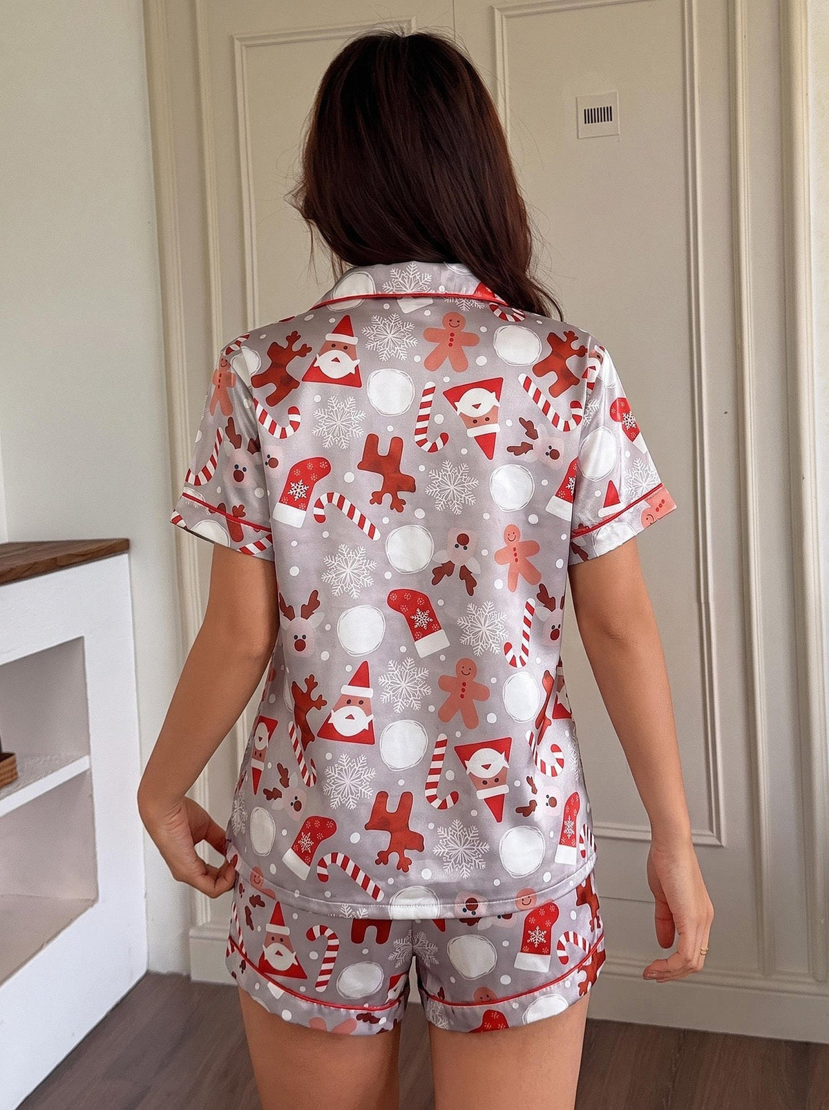 Gray satin Christmas pajama set with candy cane and reindeer print, short sleeve notched collar top and shorts with red piping - view 2