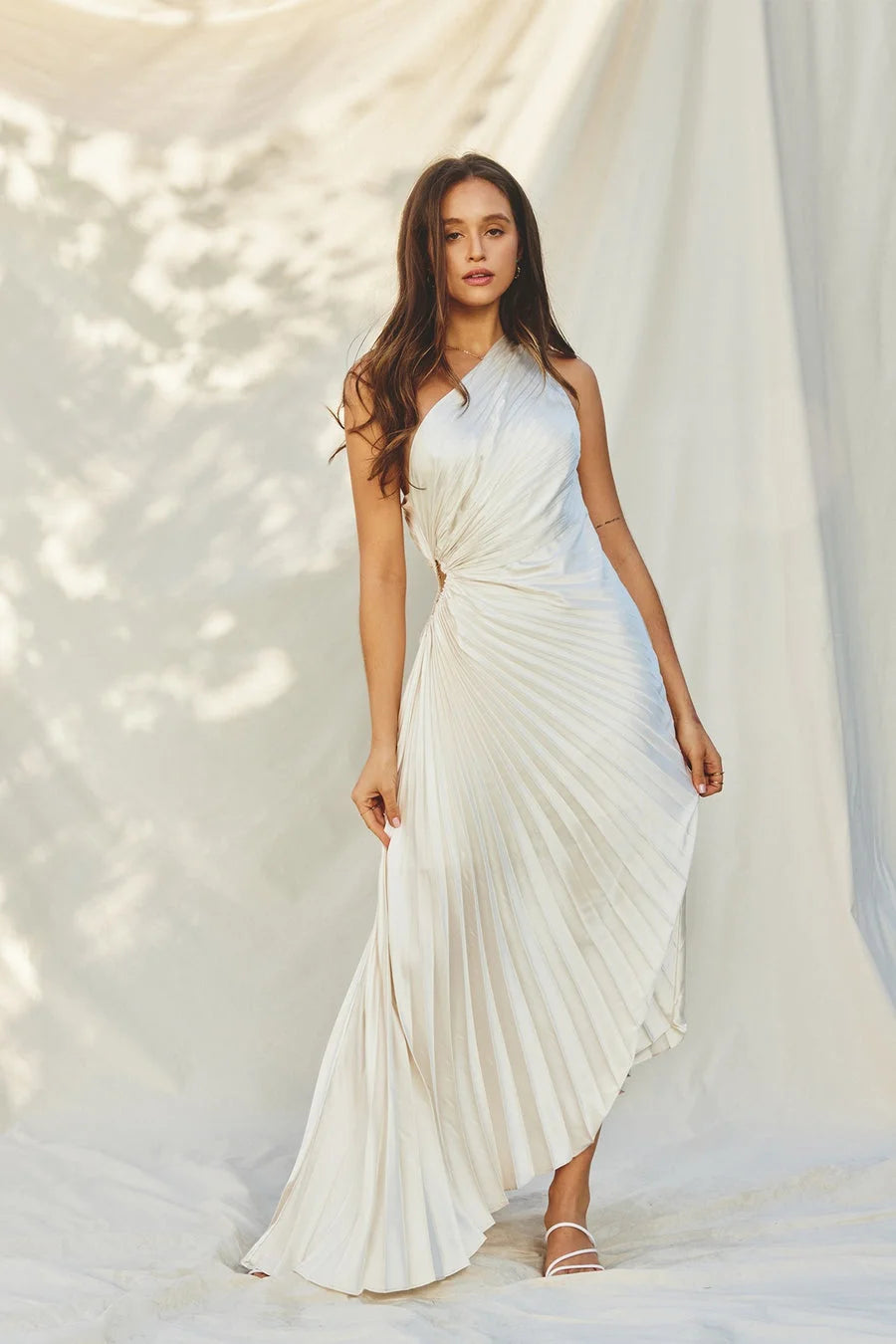 One-shoulder pleated satin maxi dress with waist cut-out and asymmetric hem