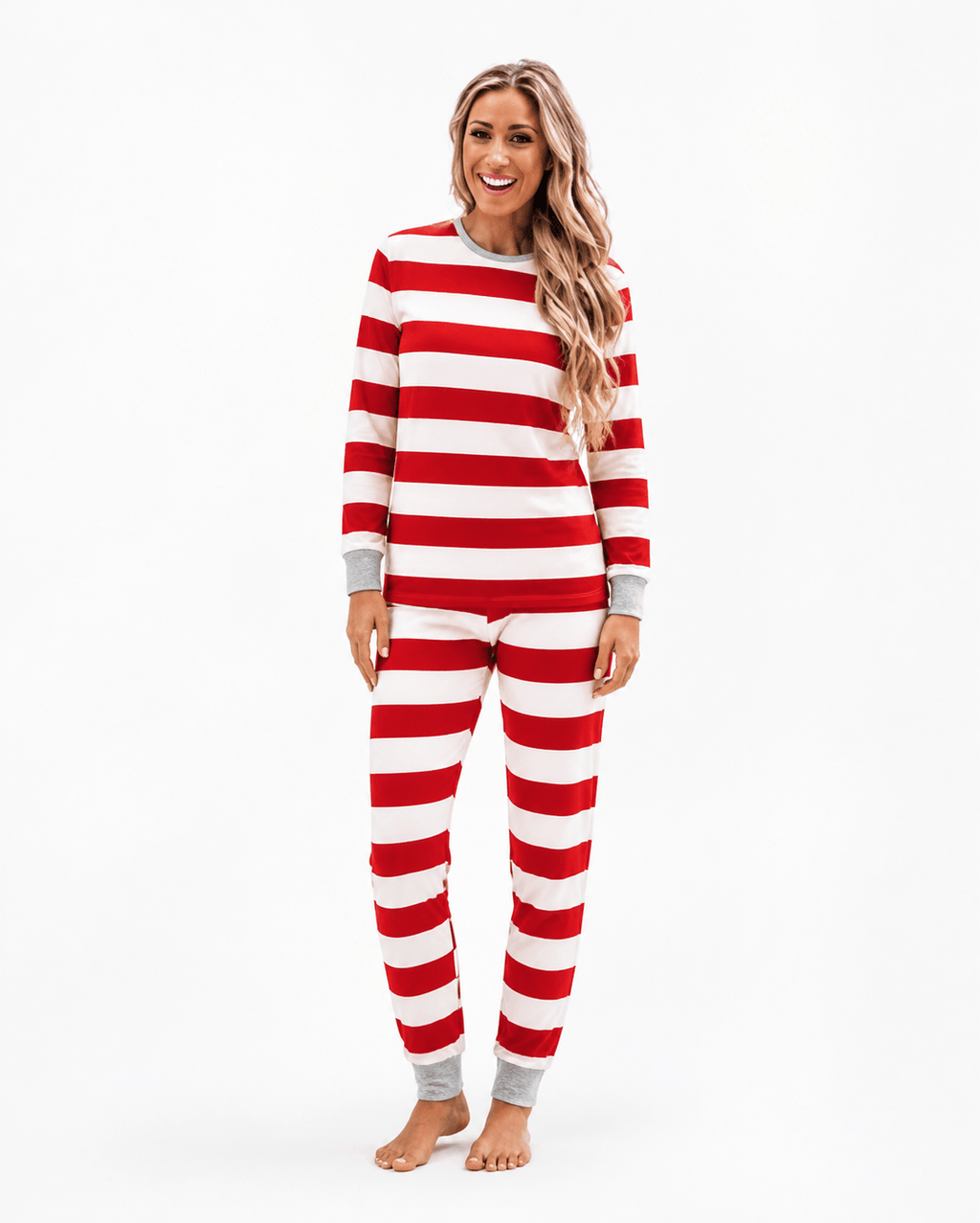 Family wearing matching red and white striped Christmas pyjamas with grey cuffs - view 10