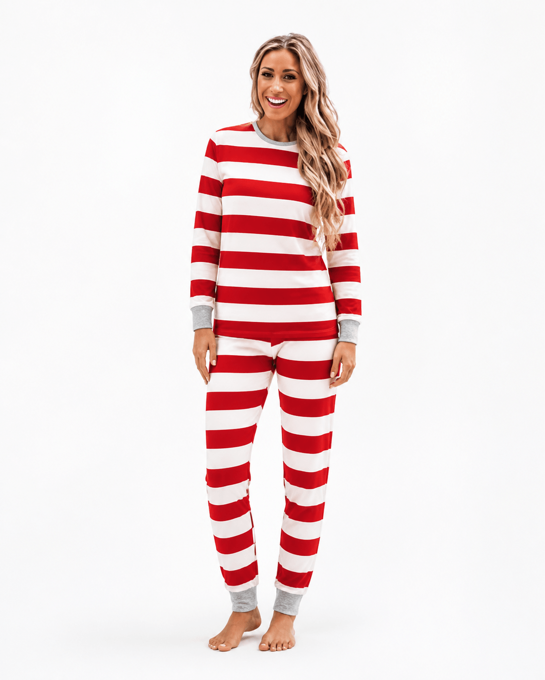 Family wearing matching red and white striped Christmas pyjamas with grey cuffs - view 10