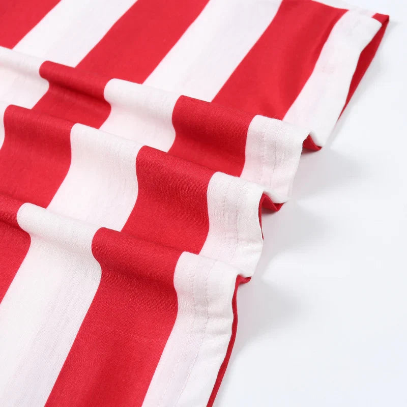 Family wearing matching red and white striped Christmas pyjamas with grey cuffs - view 14