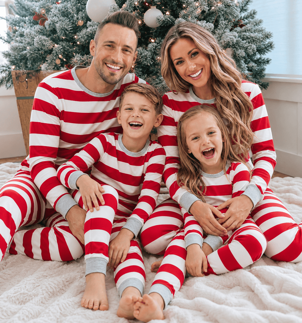 Family wearing matching red and white striped Christmas pyjamas with grey cuffs - view 4