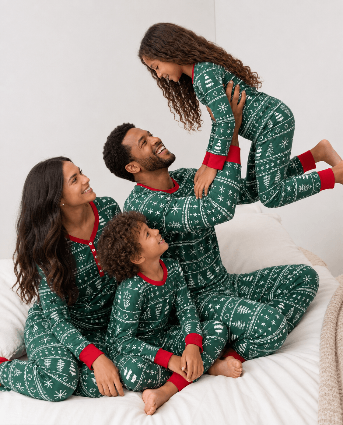 Family wearing matching green Christmas tree print pyjamas with red cuffs - view 3