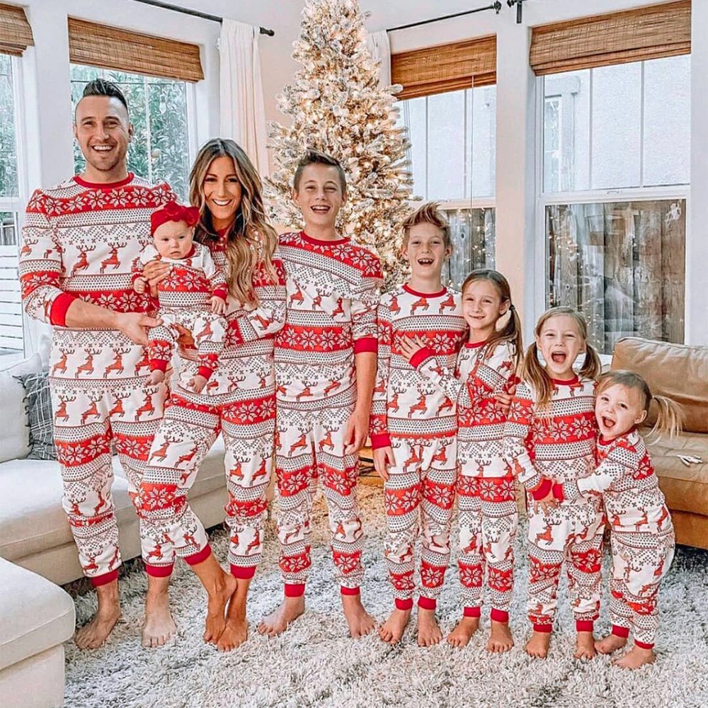 Matching family Christmas pyjamas with red reindeer and snowflake print on white - view 13