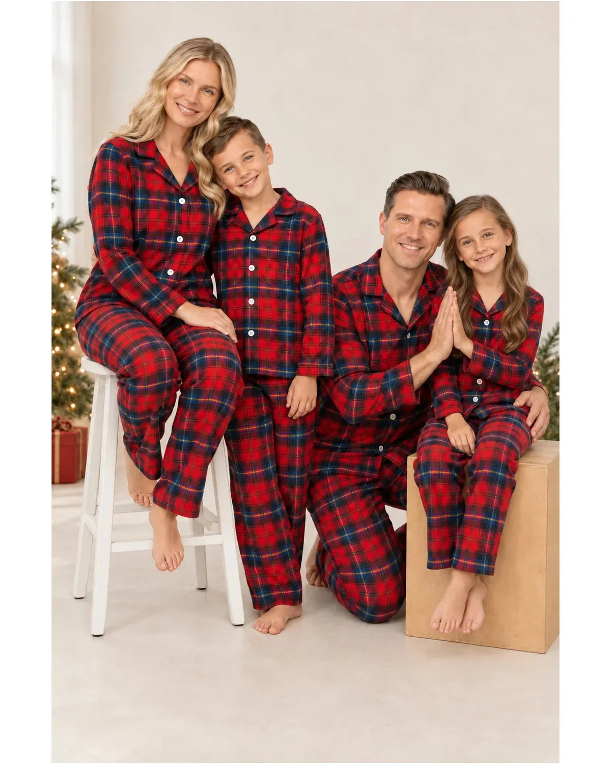 Family wearing matching red tartan flannel Christmas pyjamas with notch collar and button front - view 2