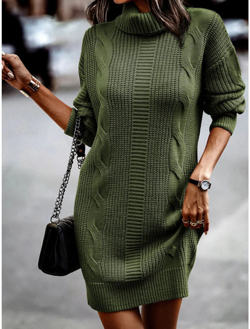 Woman wearing a cable knit roll neck jumper dress in mini length with long sleeves - view 2