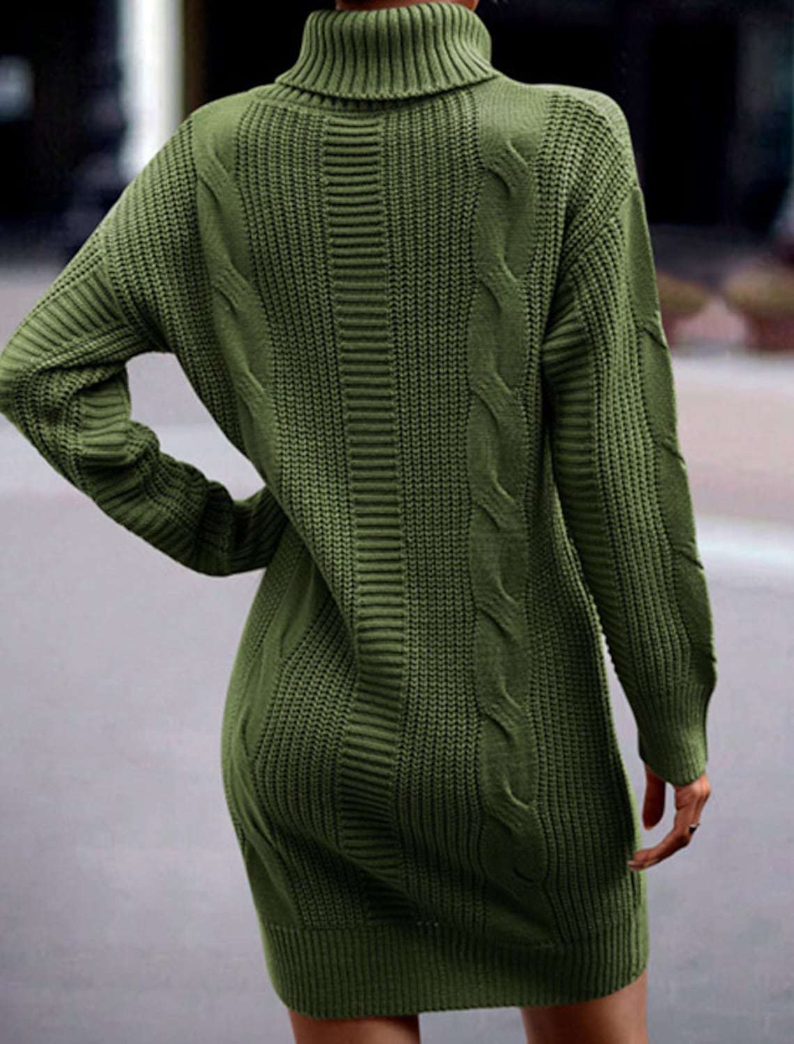 Woman wearing a cable knit roll neck jumper dress in mini length with long sleeves - view 3