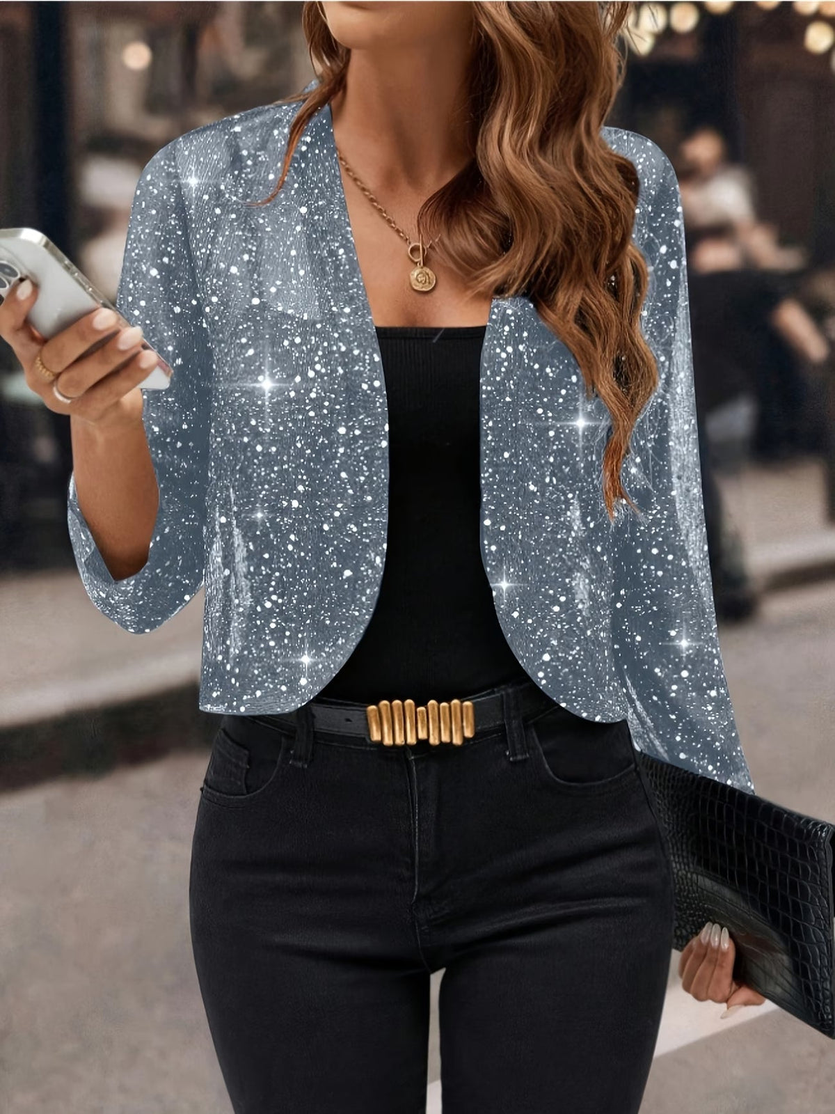 Sheer glitter open front cropped cardigan with long sleeves worn over a black vest and jeans - view 6