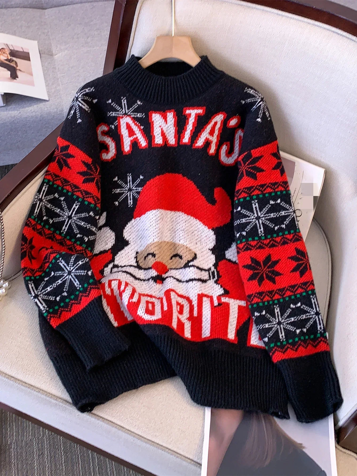 Black oversized Christmas jumper with Santa motif and red fair isle snowflake sleeves