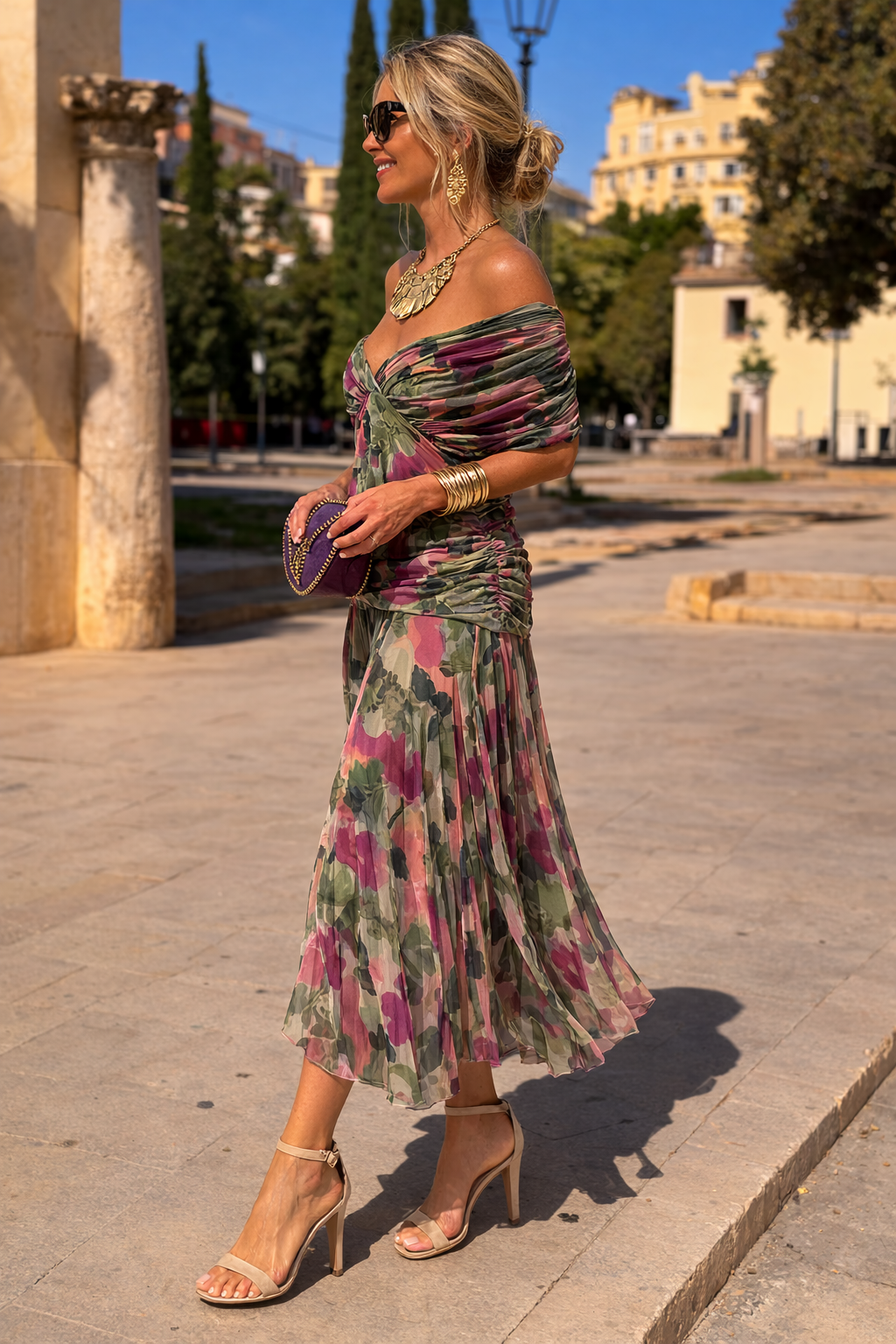 Woman wearing a draped off-shoulder maxi party dress with ruched waist and sheer flowing skirt - view 8