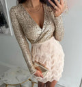 Sequin long sleeve mini dress with wrap V-neck and tiered fringe skirt